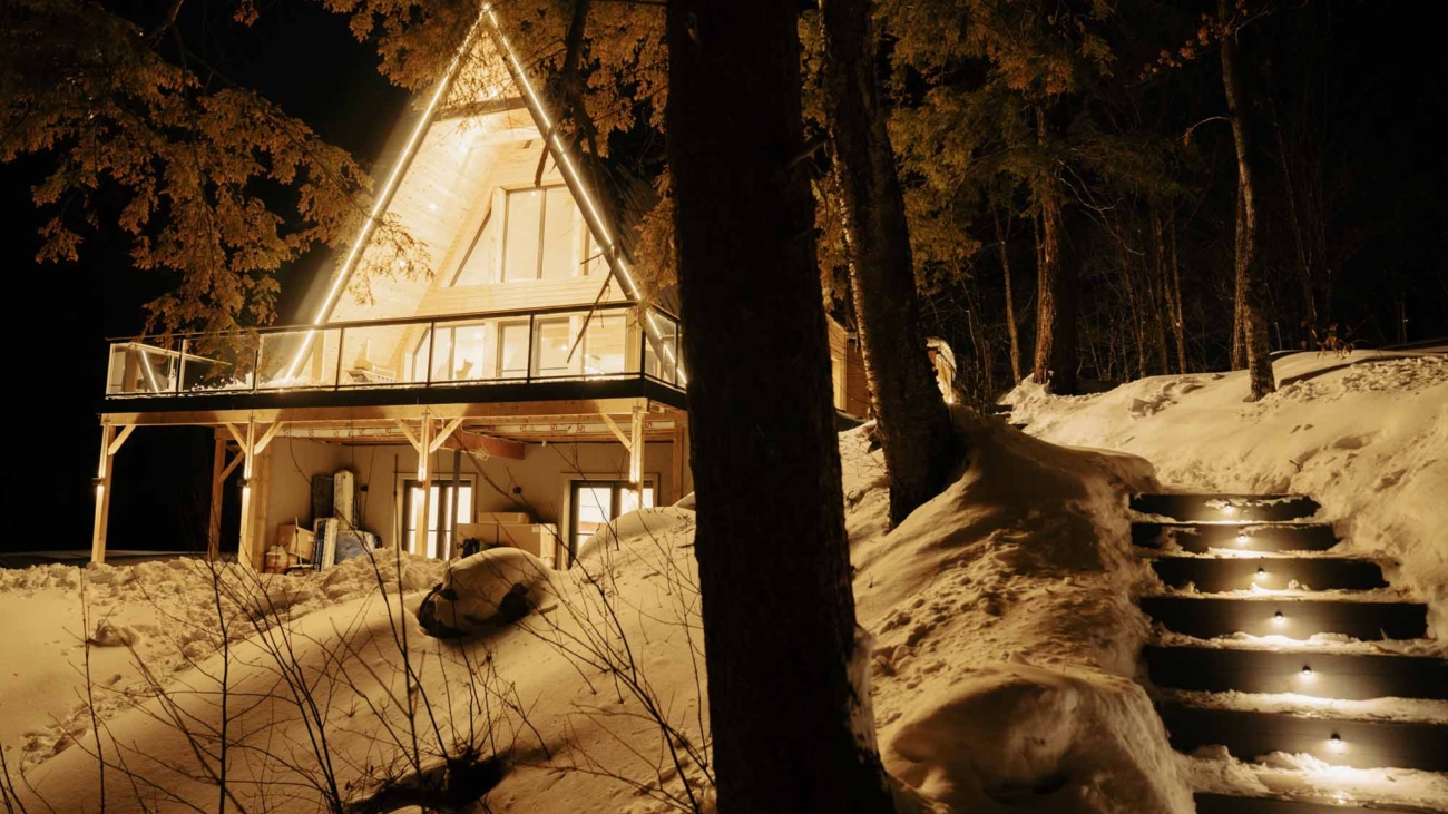 Twilight exterior real estate photograph of an illuminated modern home
