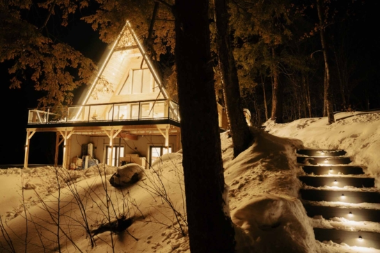 Twilight exterior real estate photograph of an illuminated modern home