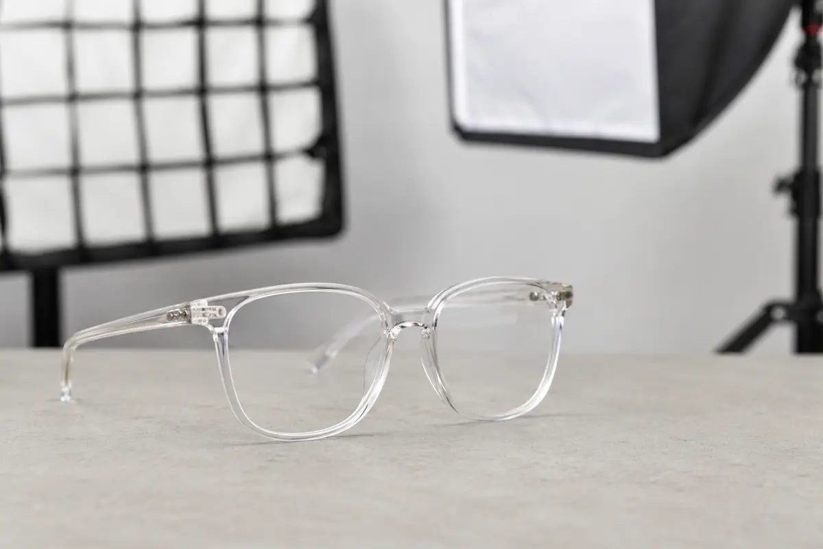 Clear prescription glasses under controlled studio lighting to prevent glare