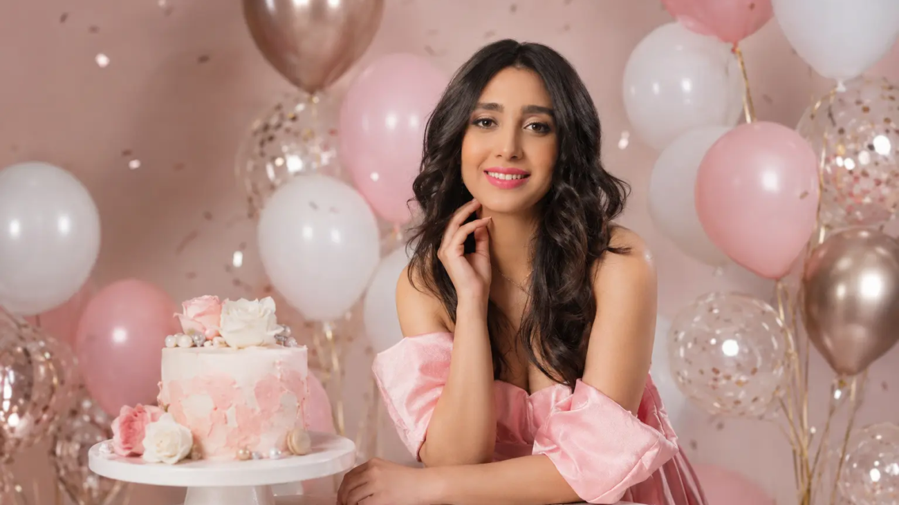 Professional birthday photoshoot studio in Toronto with pink balloon decor and elegant cake