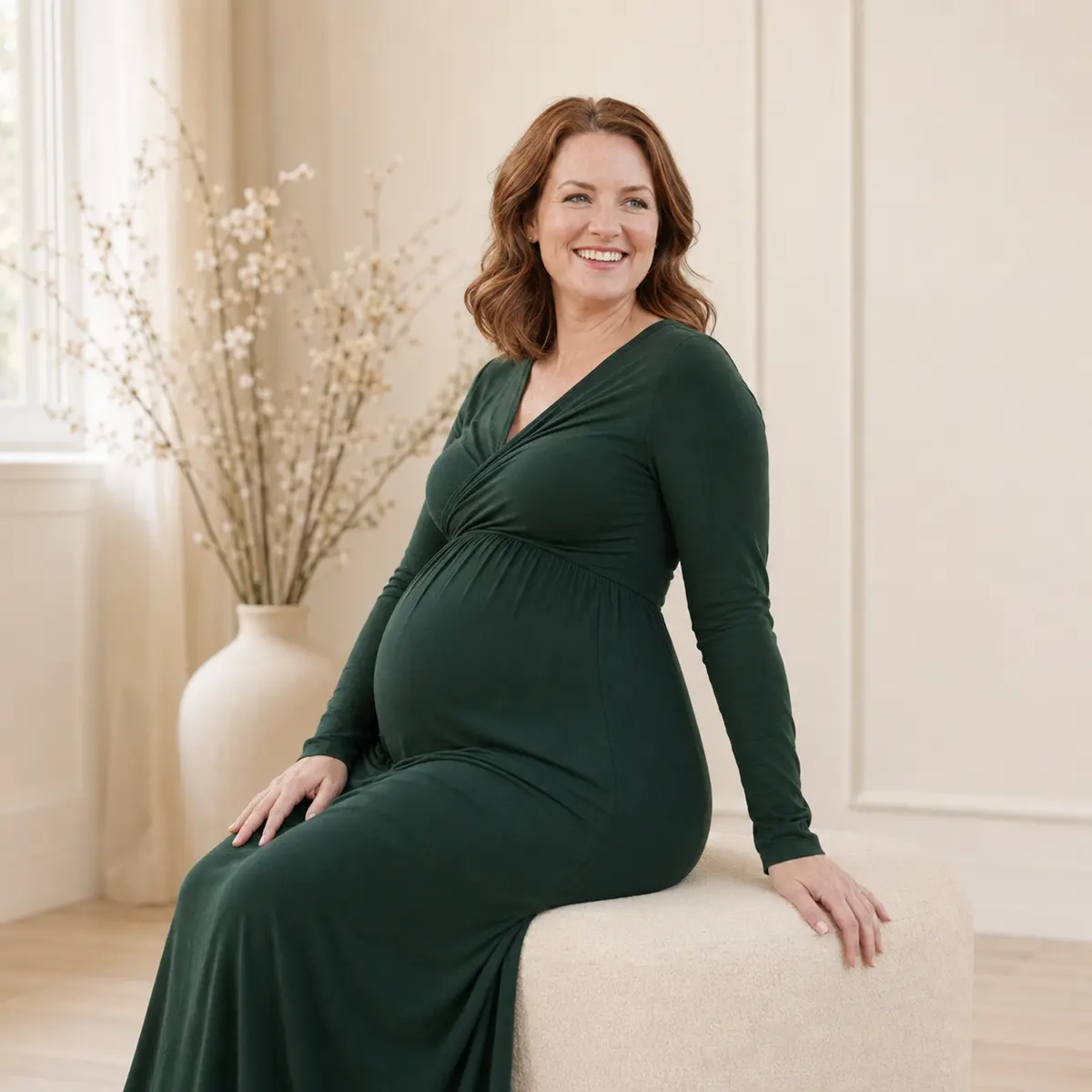 Natural seated maternity portrait in a green gown in Markham
