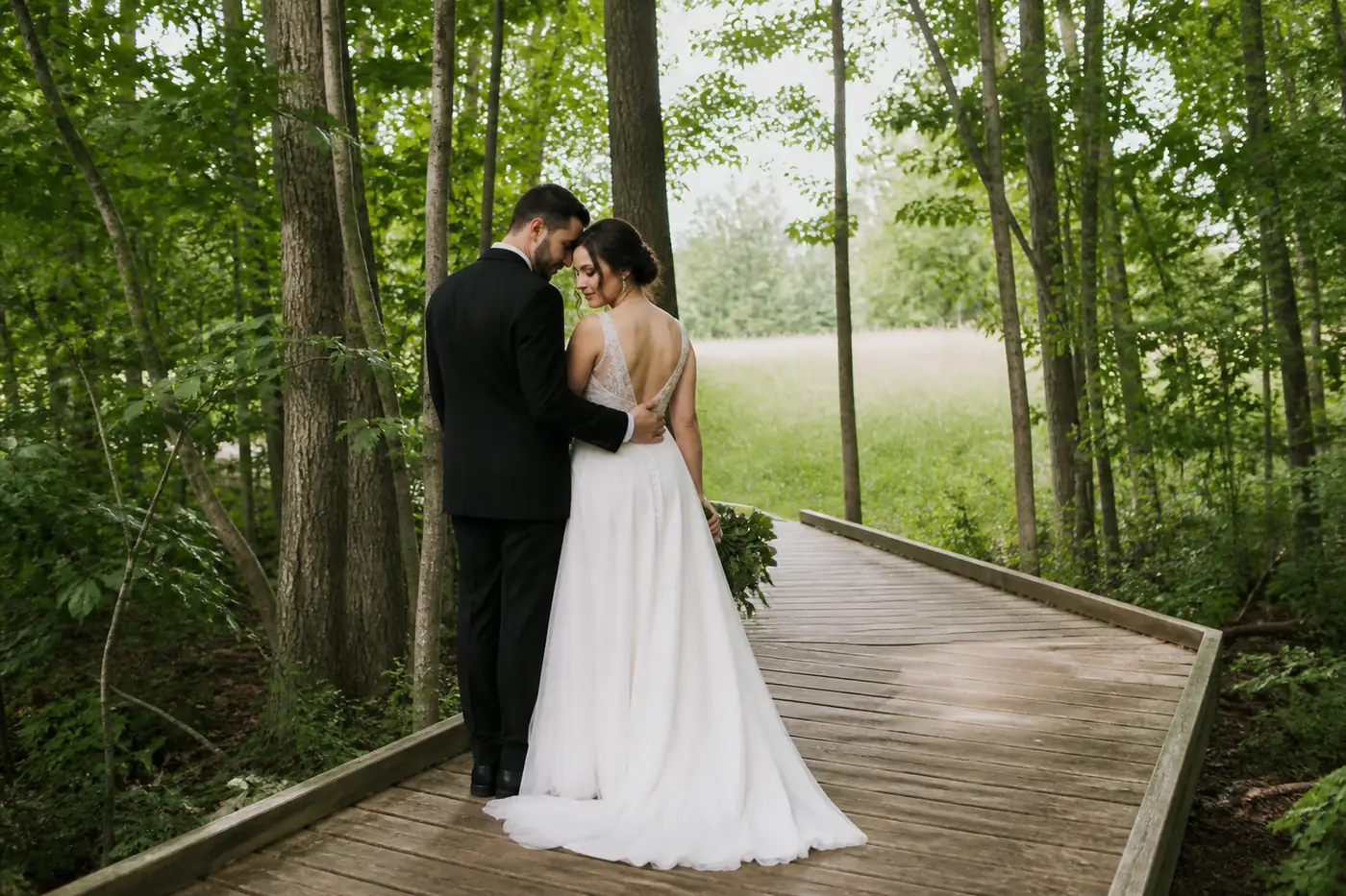 Bride and groom on a forest boardwalk wedding photo setting near Vaughan