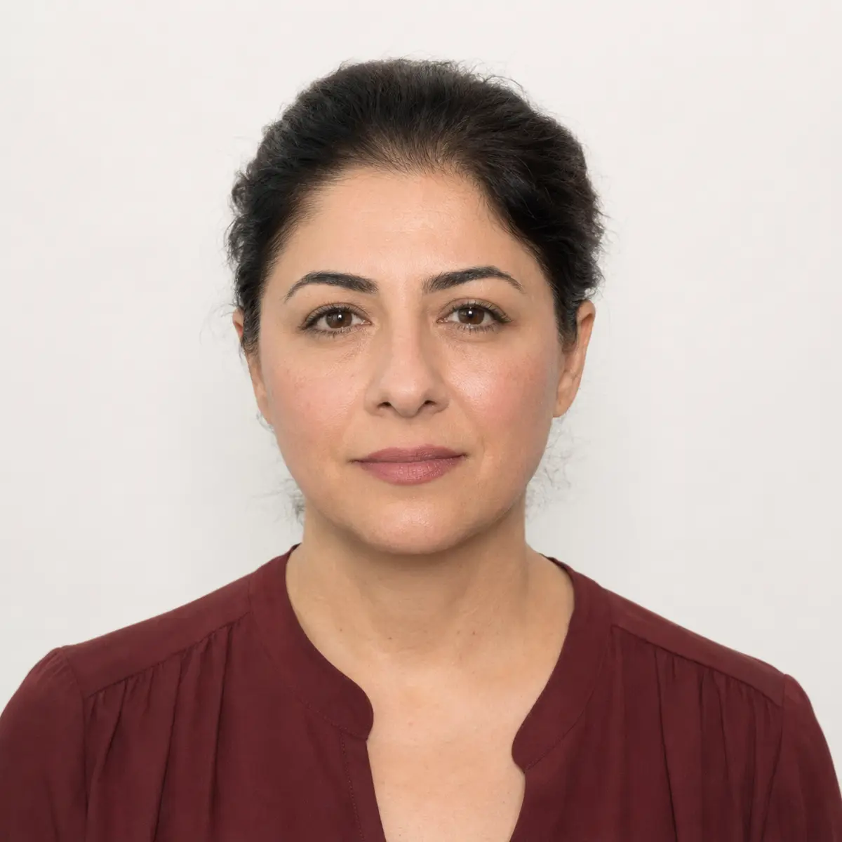 Professional passport photo of an adult woman photographed in Toronto