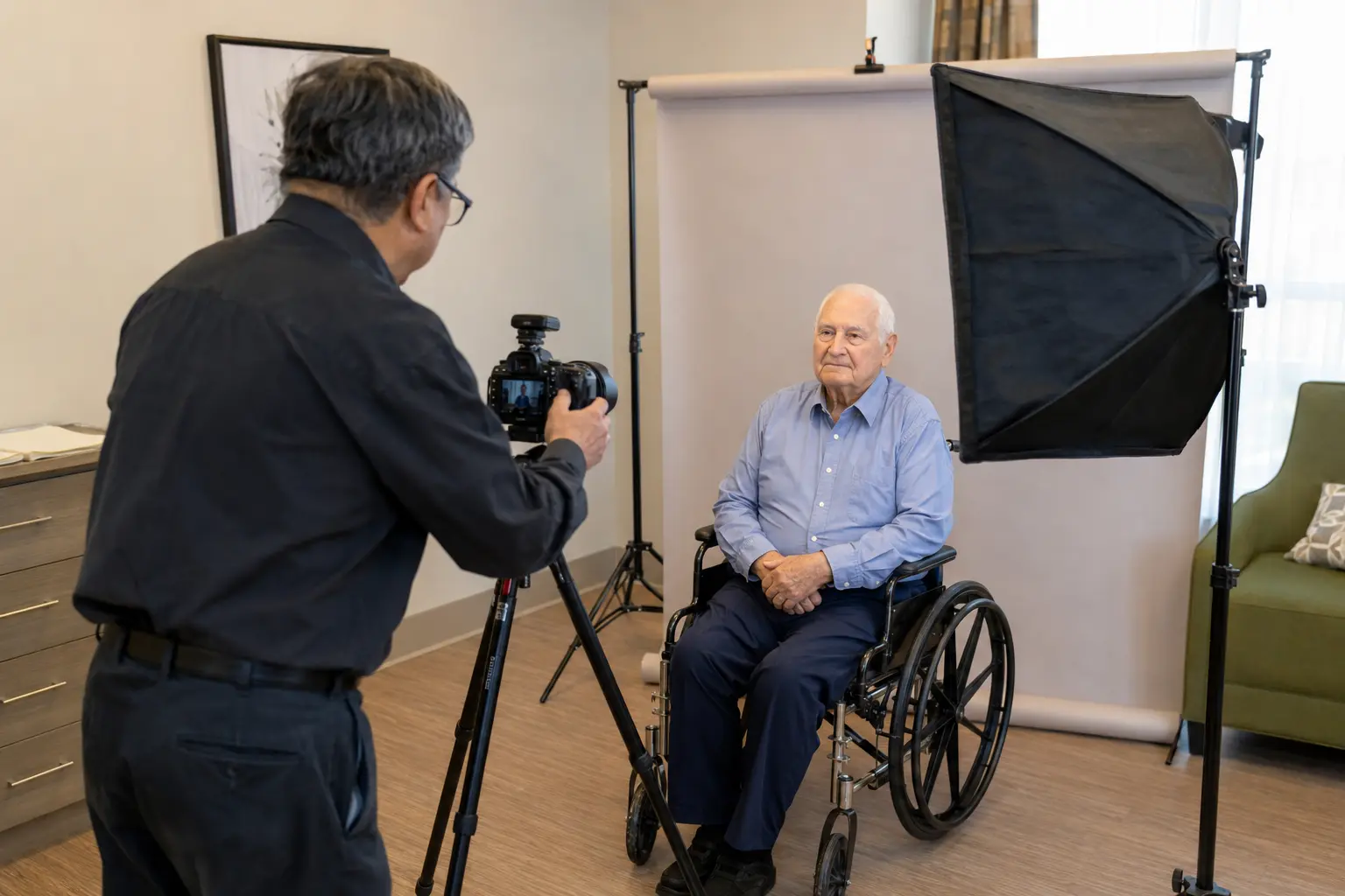 Senior in a wheelchair during a mobile passport photo session at a care home