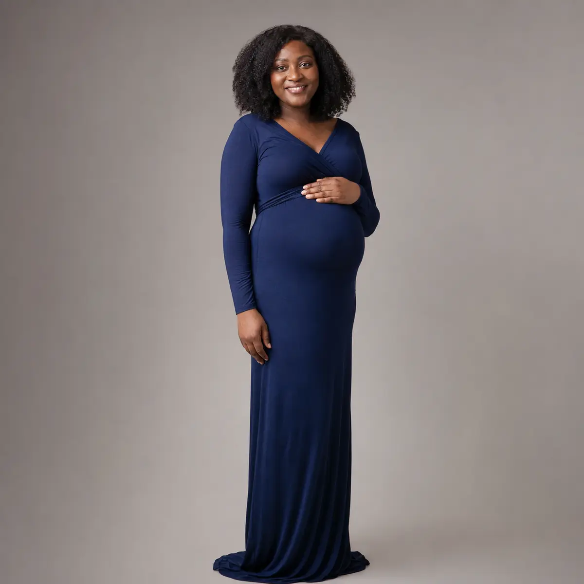 Professional maternity studio portrait in a navy gown in Markham