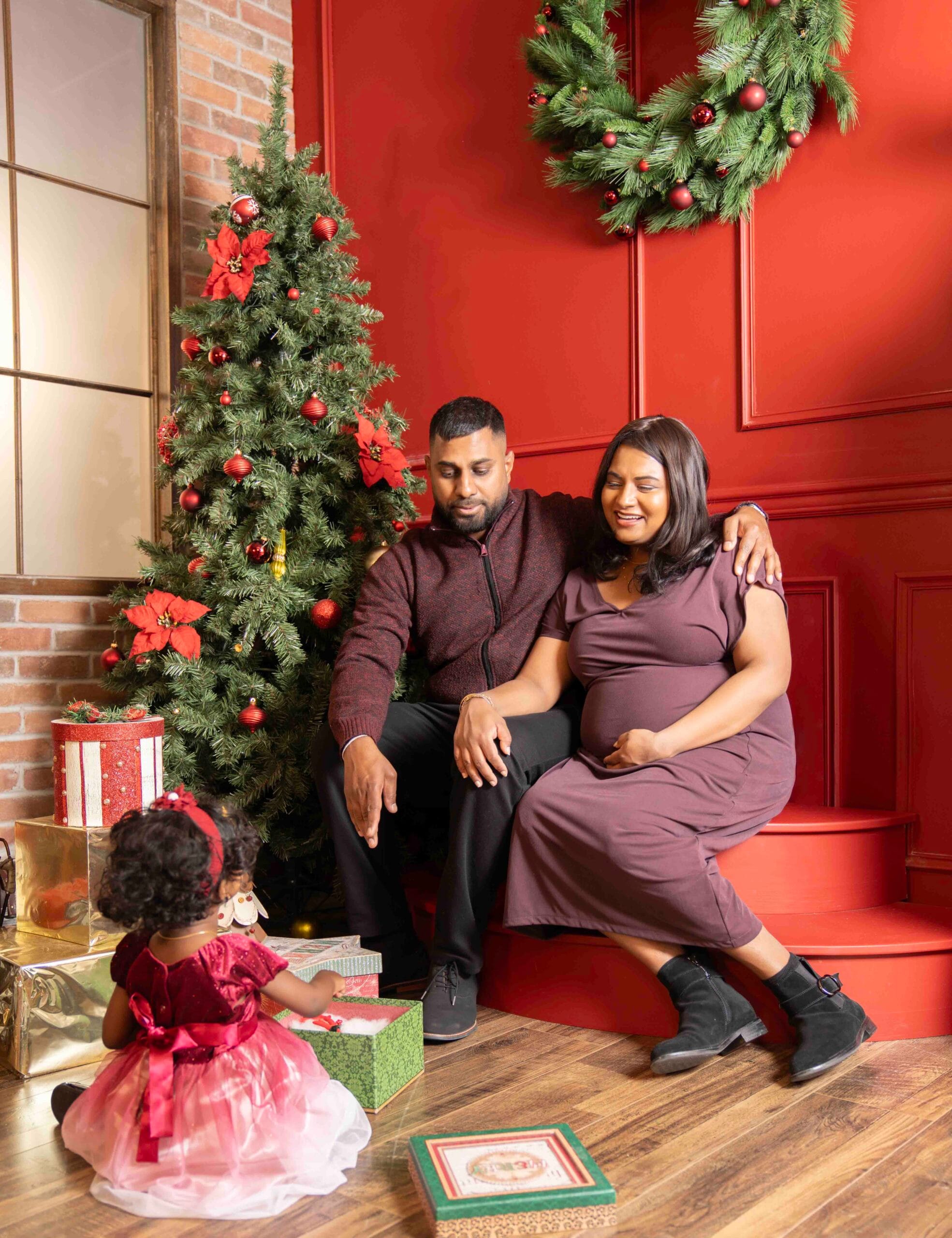 Natural family moment during a Toronto Christmas studio photoshoot