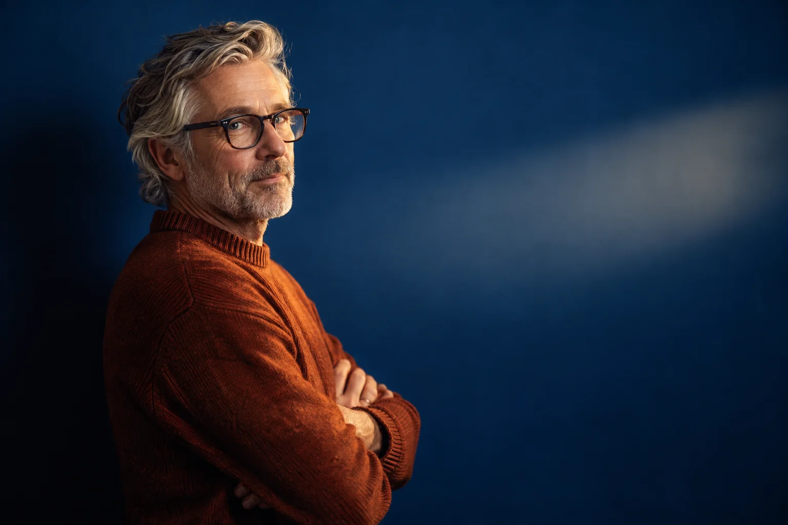 Creative editorial portrait with blue studio background