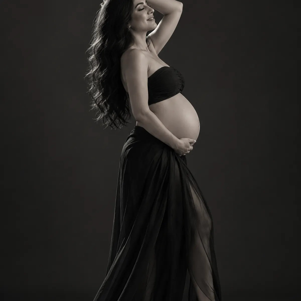 Black-and-white editorial maternity portrait in a Markham studio