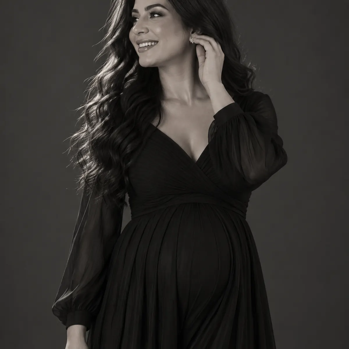 Candid laughing maternity portrait in a Markham photography studio