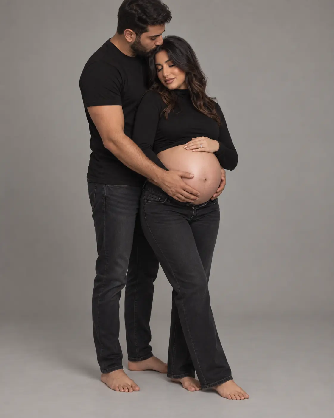 Full-length maternity couple portrait in a Markham studio
