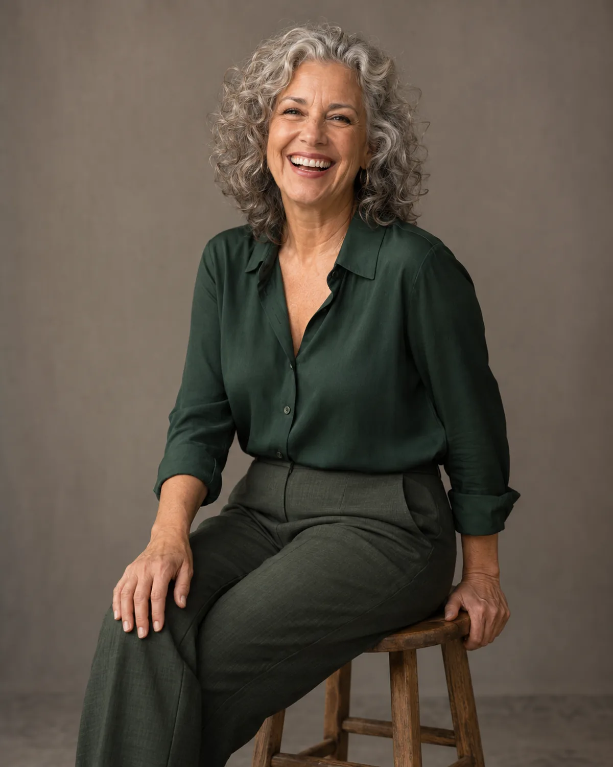 Natural studio portrait of a woman celebrating a milestone