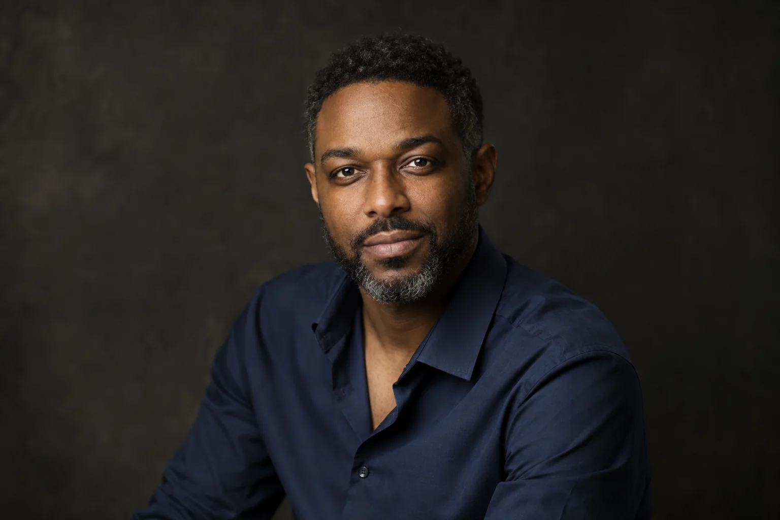 Professional male headshot with dark studio background in Richmond Hill