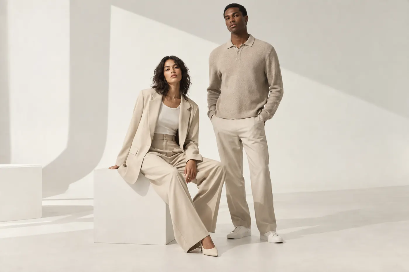 Two models wearing a neutral designer collection during a Toronto lookbook photoshoot