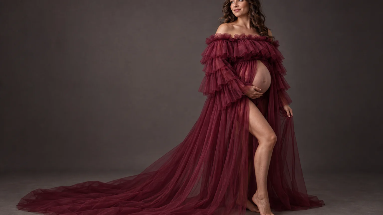 Pregnant client wearing a free burgundy tulle maternity dress in Toronto studio