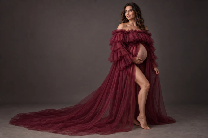 Pregnant client wearing a free burgundy tulle maternity dress in Toronto studio